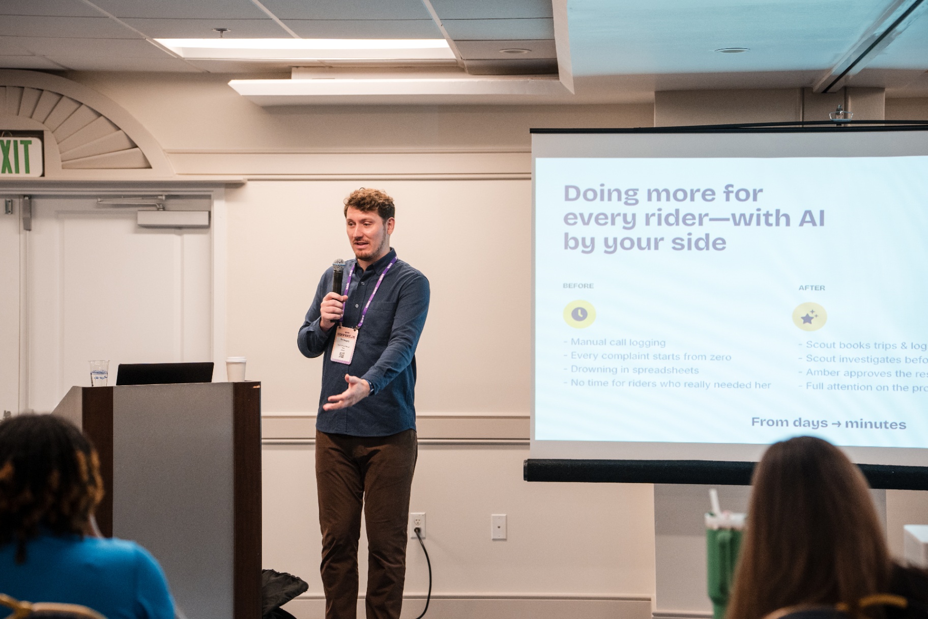 Speaker presenting beside a slide reading 'Doing more for every rider—with AI by your side'