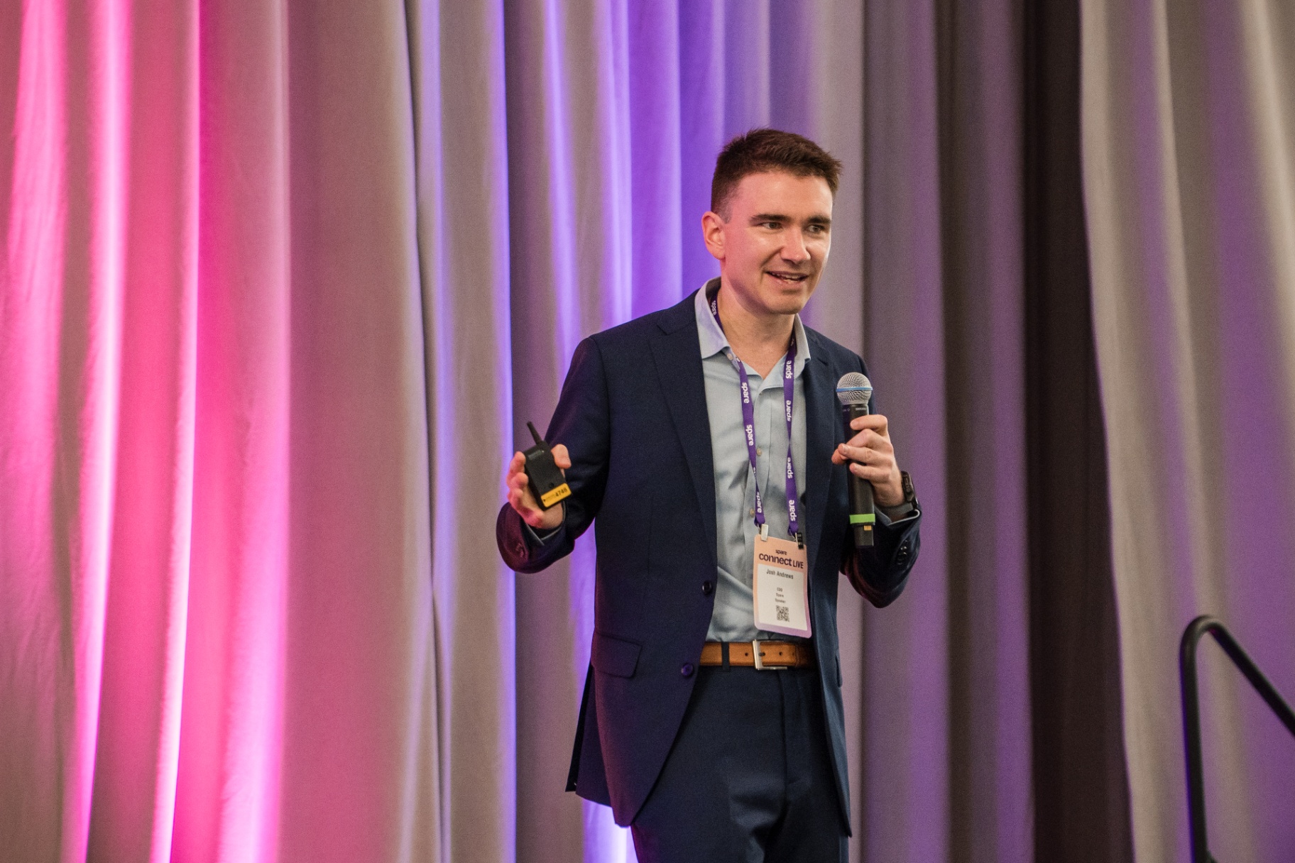 Close-up of keynote speaker holding microphone