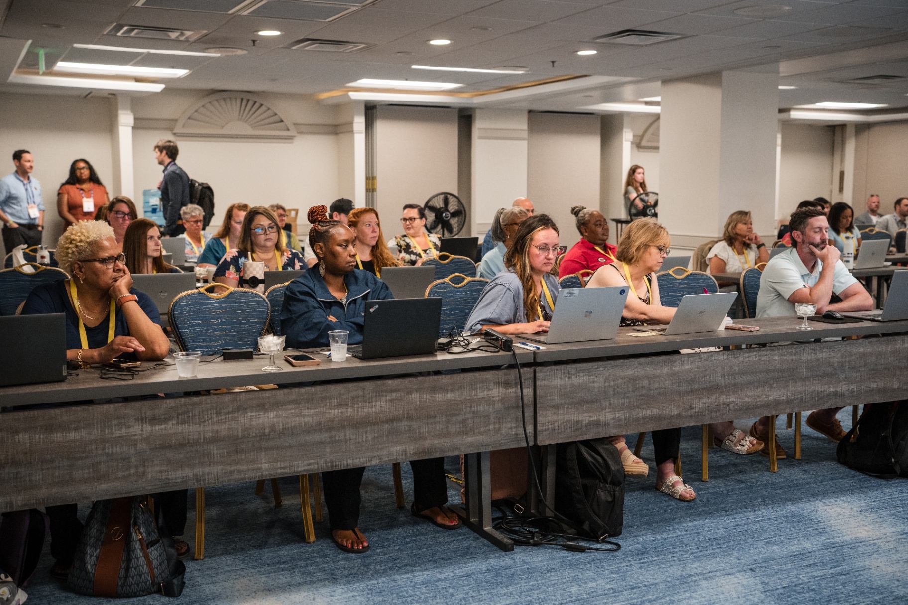 Audience members listening attentively during the Day 2 AI session
