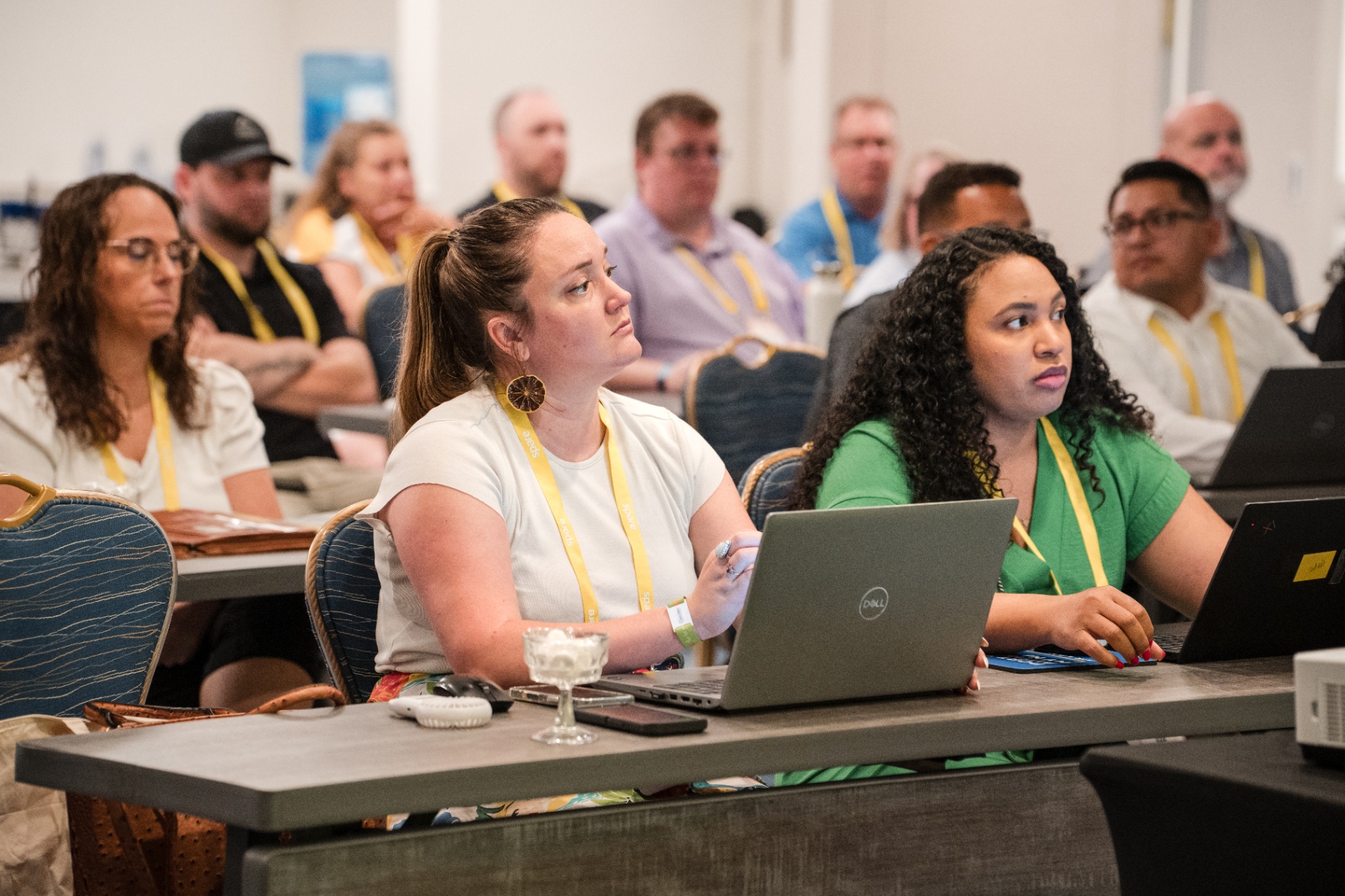 Focused audience members at a Day 1 breakout session