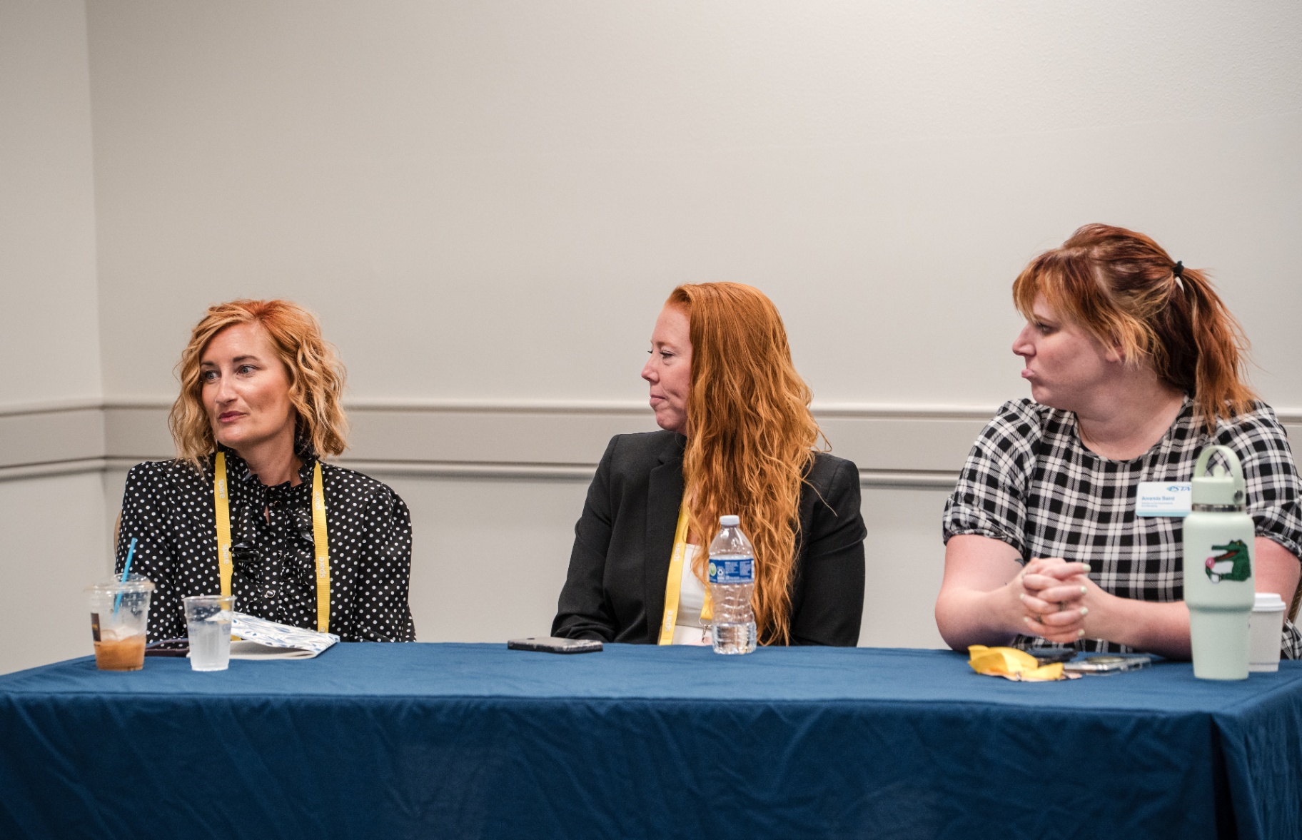 Three women on a panel during a Day 1 breakout discussion