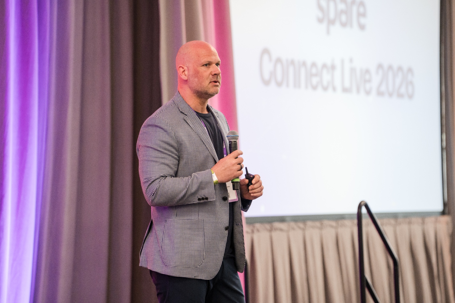 Speaker on stage during the Spare Connect Live 2026 close