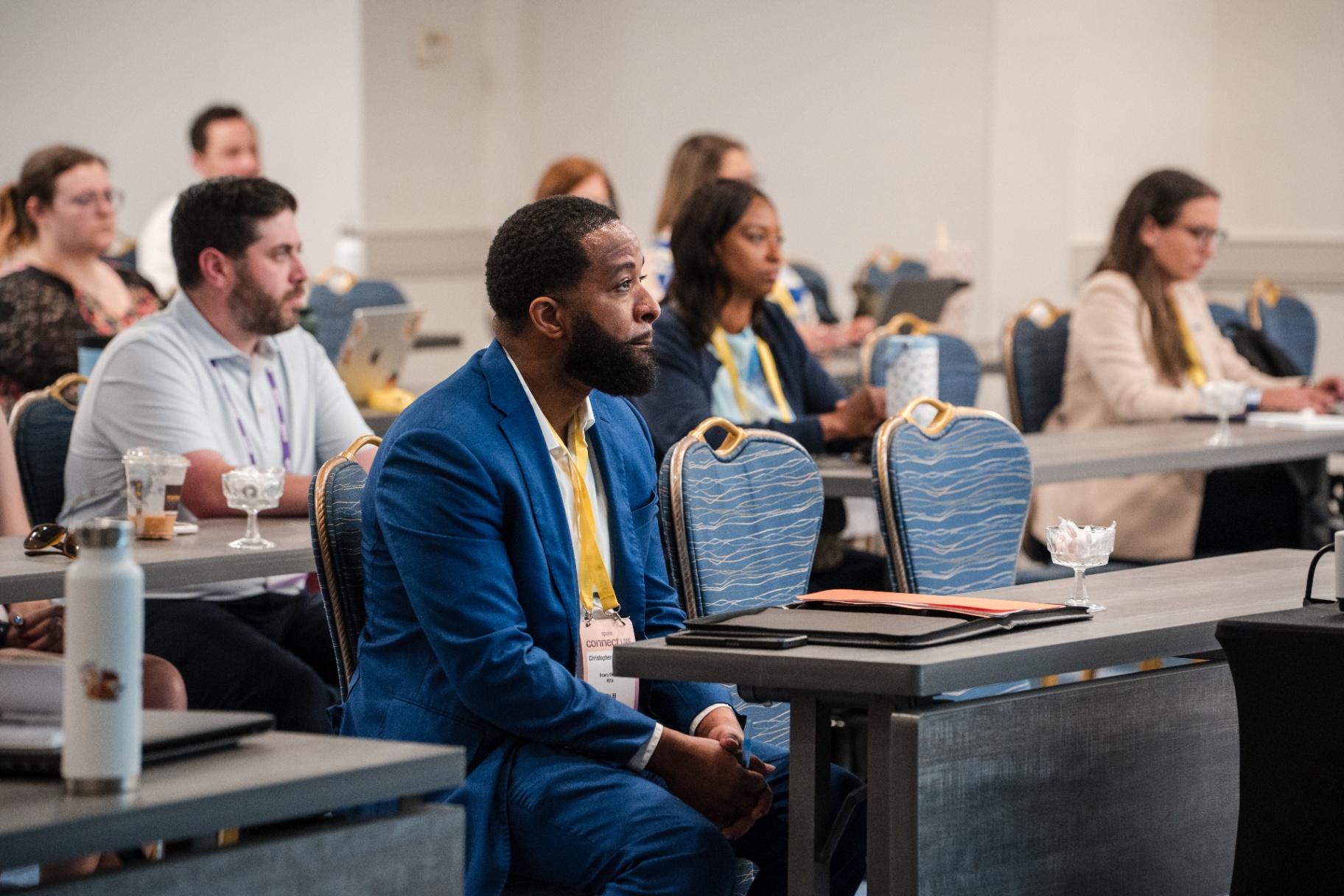 Audience members seated and listening during a Day 1 session