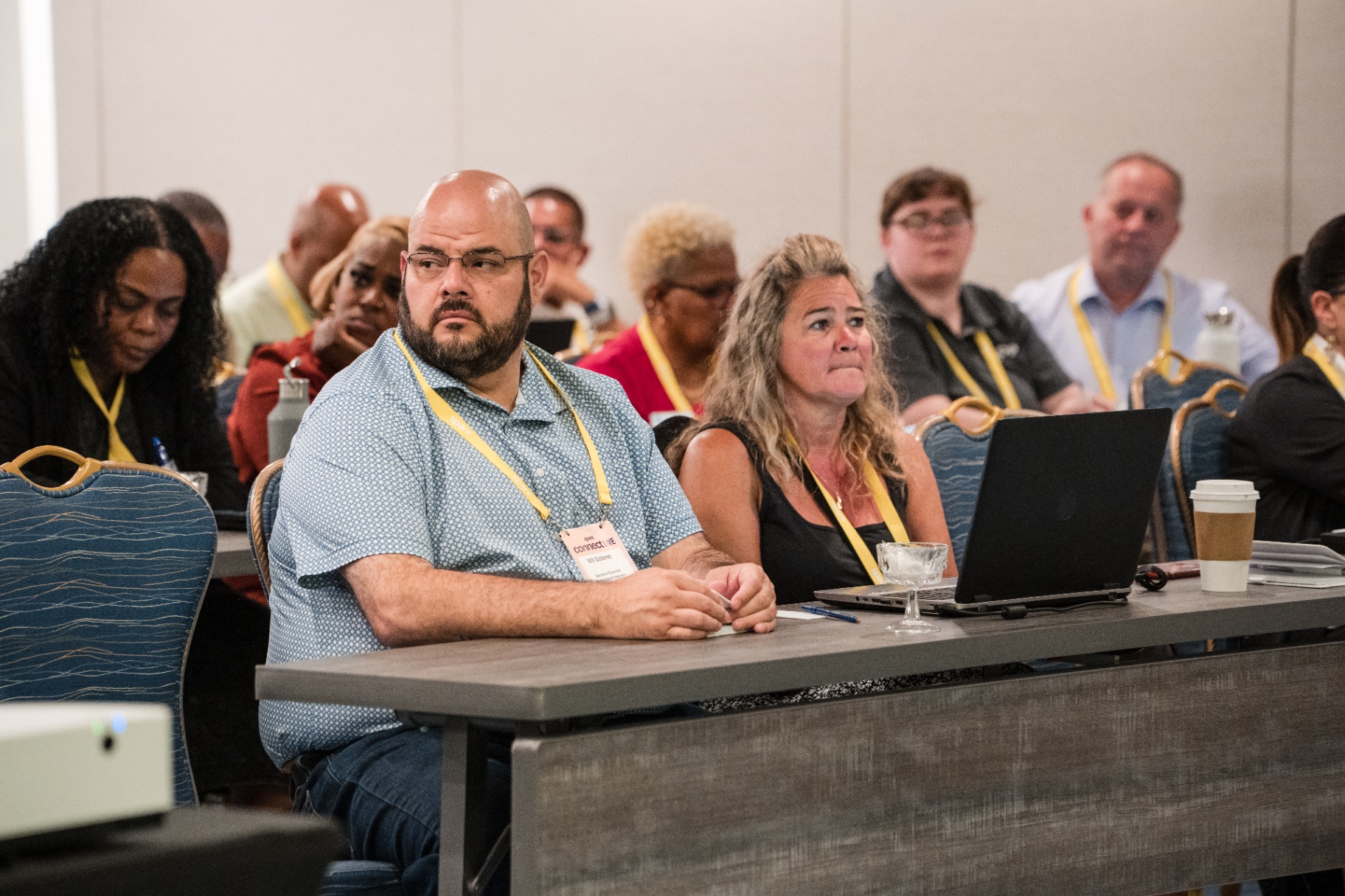Attendees listening intently during a Day 1 presentation